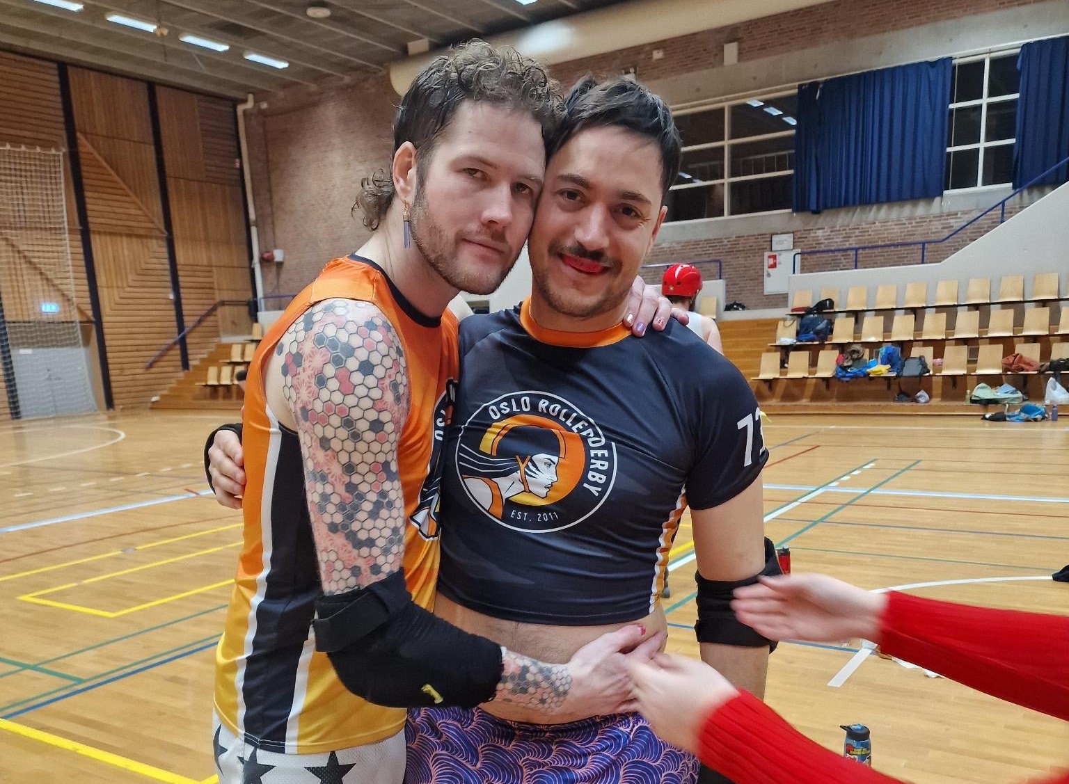 Beppe and Roy in Oslo Roller Derby uniforms